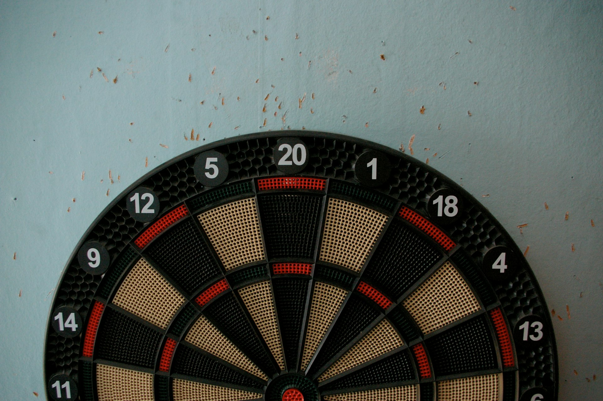 a close up of a dart board on a wall